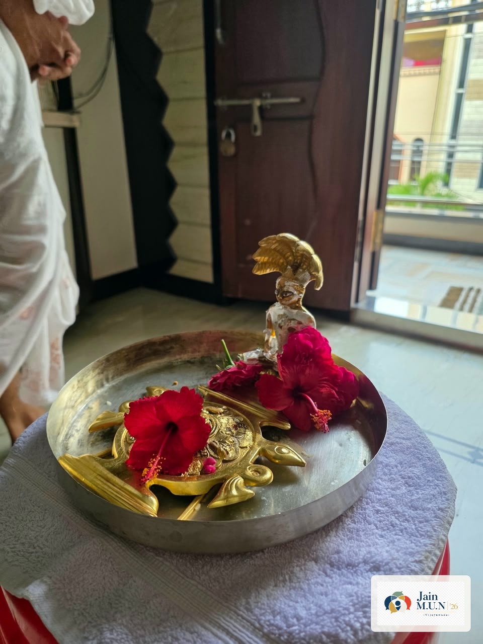Pratimaji prepared with flowers for home puja.