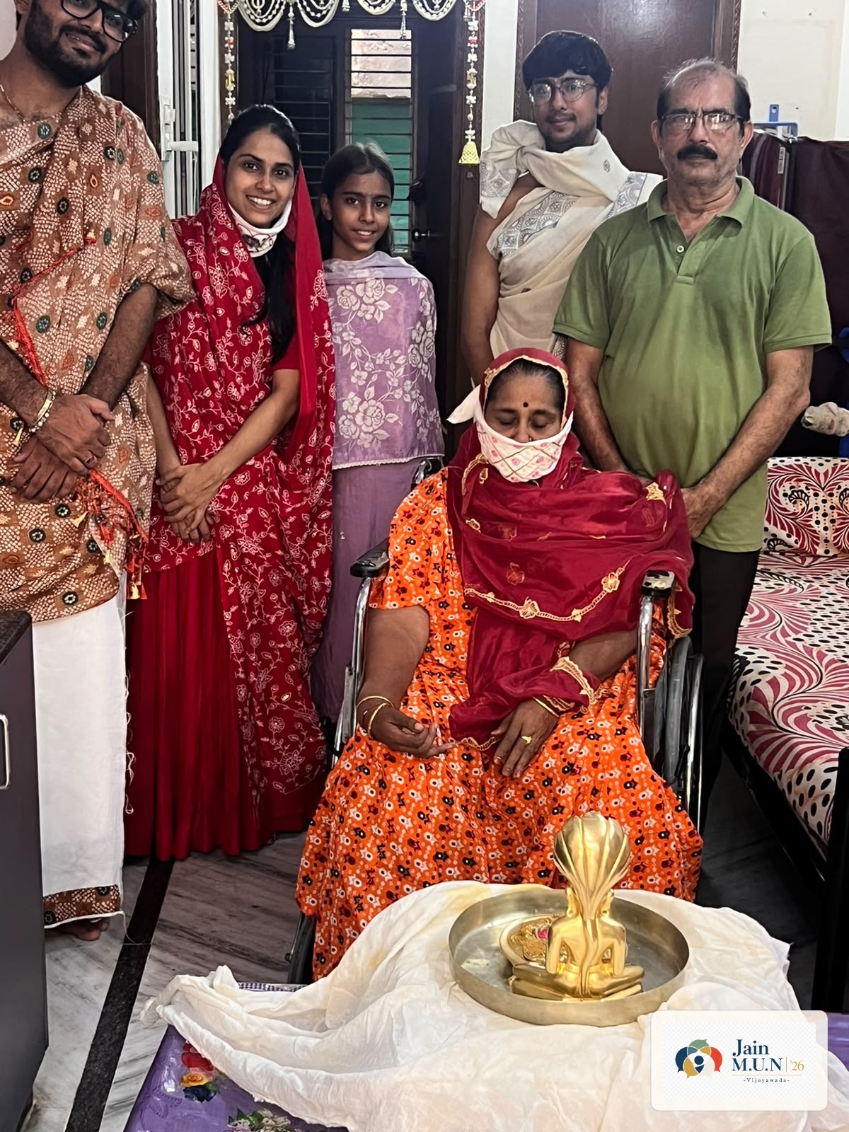 Jain MUN volunteers and family gathered after puja.