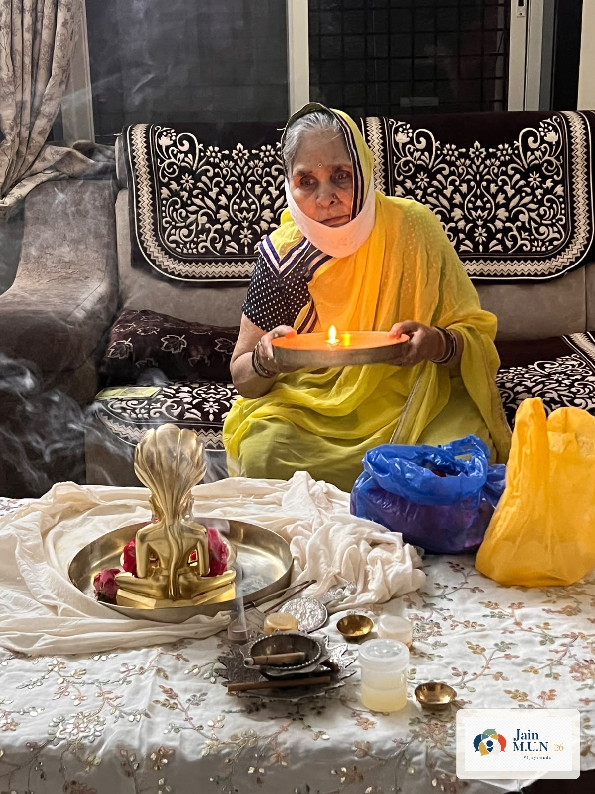 Aarti at home during Ghar-Ghar Puja Seva.